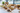 Small kraft paper side plates in paper tableware catering setup