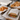 PFAS-free greaseproof paper used for bakery pastries and deli sandwich packaging