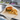 Greaseproof wrapping paper used for burgers and fries in takeaway foodservice packaging